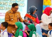 Pj Bupati Indra dan Bunda PAUD Barito Utara Hadiri Peringatan Hari Anak Nasional Ke-41
